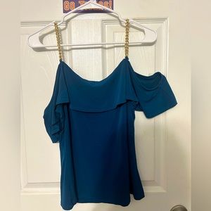 off shoulder top with gold chains